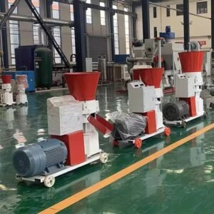 Industrial pellet machines with red hoppers and electric motors in a factory setting.